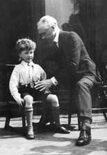 teaching small boy sitting on low chair